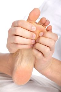 8863735 - female feet massage. over white background